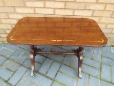 A coffee table with brass inlay 51cm x 77cm x 41cm - This lot MUST be paid for and collected,