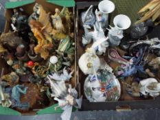A good mixed lot of two boxes containing a quantity of figurines of mythical creatures, dragons,