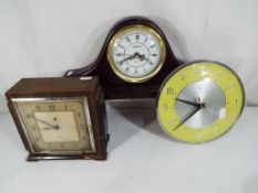 Two electric clocks, Metamec and Smiths