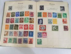 A vintage Royal Mail stamp album contain