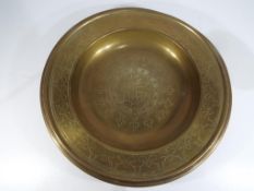A large brass collection plate, 38.5 cm