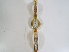 A decorative lady's wristwatch in case -