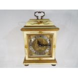 A mantel clock in the style of an early English bracket clock by Elliotts of London,