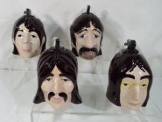 Lorna Bailey - four Lorna Bailey novelty teapots in the form of The Beatles.