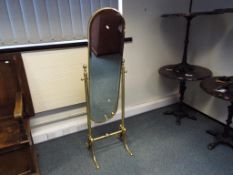 A good quality heavy brass framed cheval mirror approx 148cm (h)