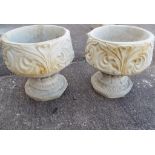 Two Fleur de Lys stone urns with a triple petal design (2) Est £30 - £50