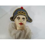 A good quality ceramic wall mask in the form of a clown entitled Napoleon,