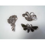 A mixed lot comprising three silver brooches of which two set with marcasite,