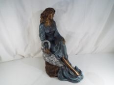 A plaster sculpture depicting a lady with swan by Austin Productions, approx.