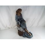 A plaster sculpture depicting a lady with swan by Austin Productions, approx.