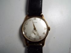 A gentleman's gold plated manual wind wristwatch by Baume & Co.