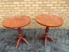Two glass top bar tables approx 71cm x 58cm (diam)