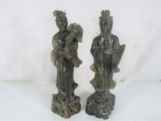 Two Qing Dynasty jade highly carved figurines depicting Guanjin and Kuan Yin (2)