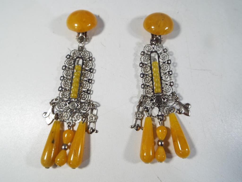 A pair of amber style drop earrings with clip-on fittings - Est £40 - £50