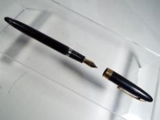A Sheaffer fountain pen with a 14 carat gold nib in original box.