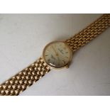 A lady's hallmarked 9 carat gold watch with hallmarked 9 carat gold bracelet,