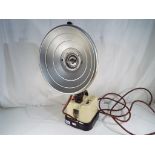 A vintage Hanovia portable ultra - violet ray lamp with cream and brown base.