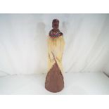 A Soul Journeys large Masai lady figurine carrying a child issued in a limited edition by Stacy