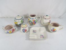 Poole Pottery - a good lot to include a quantity of Poole Pottery decorated in a floral pattern