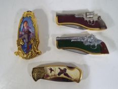 Four Franklin Mint collectors knives comprising a Lord of the Rings knife,