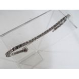 A lady's 14 carat white gold tennis bracelet set with 44 round brilliant cut diamonds presumed G/H