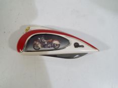 A Franklin Mint collectors knife depicting an Indian 442 motorcycle.