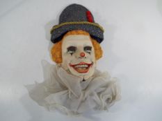 A good quality ceramic wall mask in the form of a clown entitled Auguste,