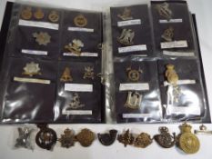 An album containing approximately 68 Regimental Cap Badges comprising 1st Life Gds, 2nd Life Gds,