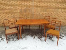 A good quality McIntosh extending dining table with three McIntosh dining chairs and three G Plan