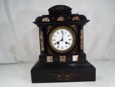 A French black marble mantel clock,