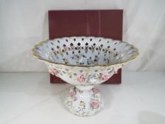 A very large Hua Jie porcelain centrepiece with pierced and floral decoration with image of a