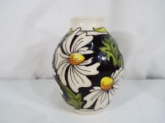 Moorcroft - a good quality Moorcroft vase decorated in the Pheobe pattern, approximate height 13.