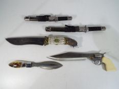 Five knives, one in the form of a revolver, one decorated to the handle with deer,