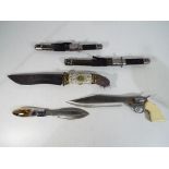 Five knives, one in the form of a revolver, one decorated to the handle with deer,