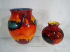 Poole Pottery - two vase by Poole Pottery decorated with abstract designs, the larger approx 16.