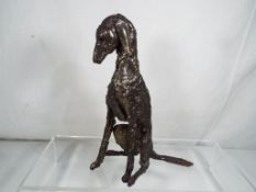 A good quality modern art bronze depicting a dog in a seated position, 16.