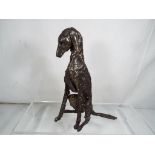 A good quality modern art bronze depicting a dog in a seated position, 16.