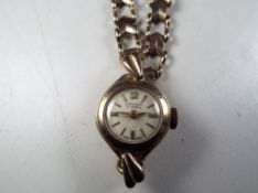 A lady's 9 carat gold wristwatch, stamped to strap 9ct (925),
