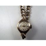 A lady's 9 carat gold wristwatch, stamped to strap 9ct (925),