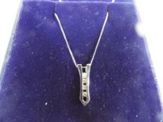 A lady's 9 carat white gold necklace with diamond pendant, boxed.