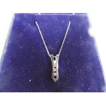 A lady's 9 carat white gold necklace with diamond pendant, boxed.