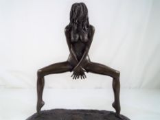 A hot cast bronze depicting a nude female on an Italian marble base,
