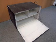 A compartmentalised metal chest containing a Victory jig saw puzzle and two board games,