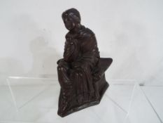 A Tara Chanda bronze depicting a classic figure of a seated woman with draped garments,