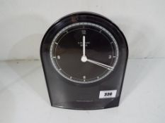 A Junghans radio controlled, battery operated mantel clock, self regulating, automatic,
