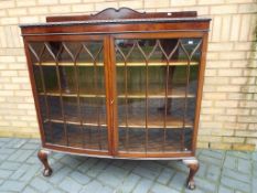A good quality three shelved mahogany display cabinet with astral glazed doors approx 133cm x 101cm