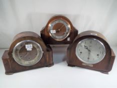 Three Westminster chiming mantel clocks to include one by Smiths Enfield and two others Estimate
