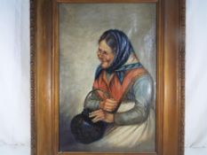 G Vitali - a framed oil on canvas depicting an elderly lady holding a cooking pot,