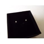 A lady's pair of 9 carat gold 10 point diamond set solitaire stud earrings,