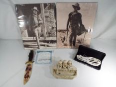 A good lot to include two prints depicting still images from John Wayne movies,